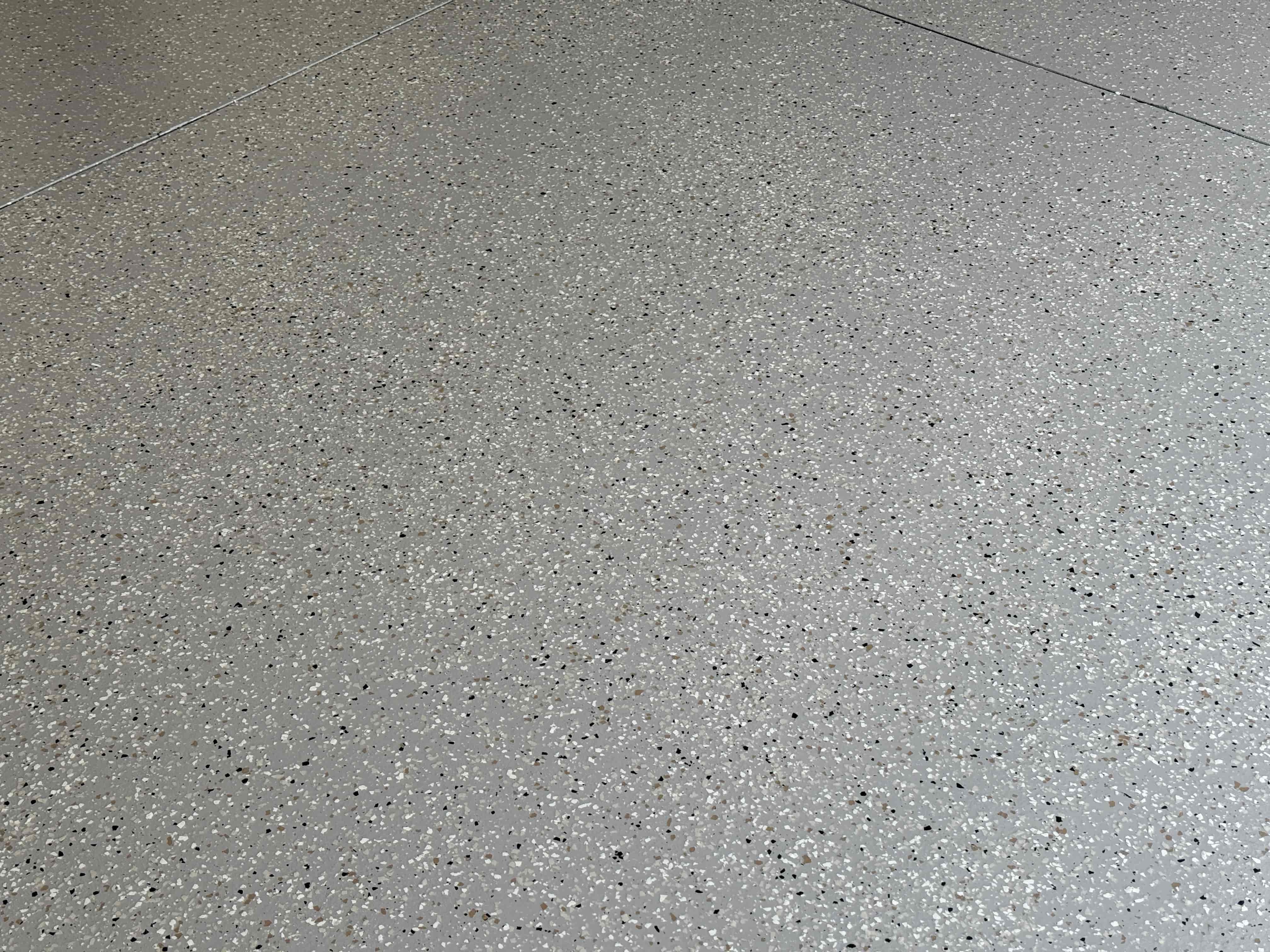Close up of Mega Greige epoxy with Shoreline flake
